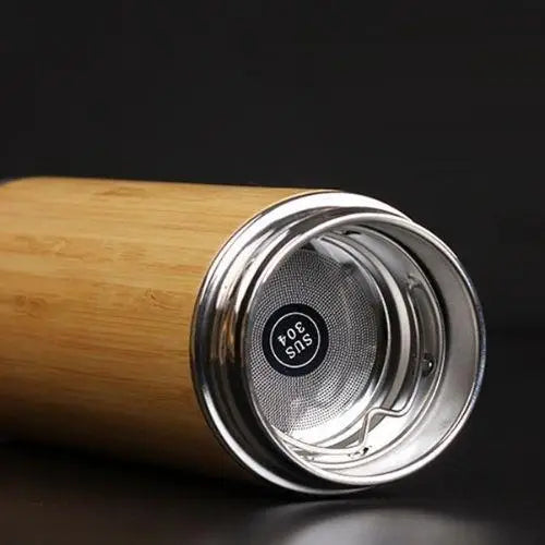 Built-in loose leaf tea infuser basket inside bamboo thermos bottle
