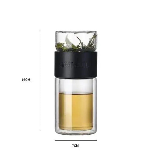 Black glass tea thermos shown next to ruler showing 16 cm height