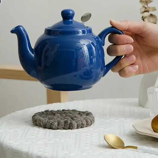 Blue ceramic teapot with lid and spout
