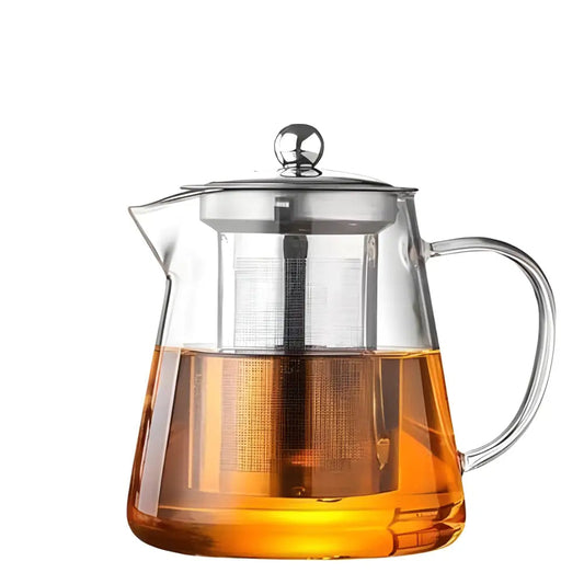 Clear glass teapot with stainless steel lid on white surface, front view
