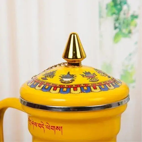 Decorative lid handle on enameled porcelain Buddhist tea kettle
