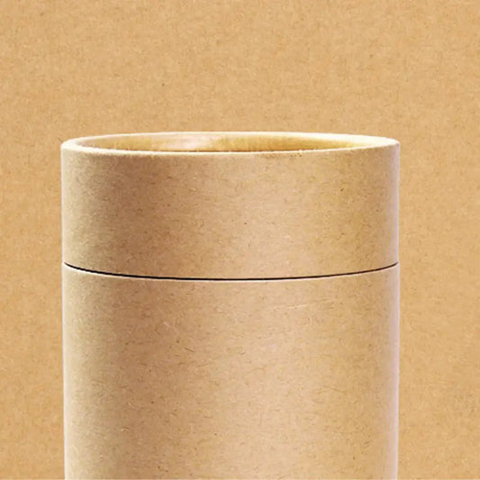 Cardboard tea organizer box on wooden countertop, lid closed
