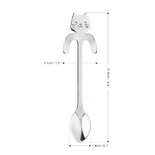 Cat tea spoon shown next to ruler to show 4.6 inch length