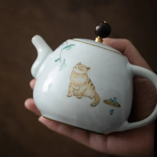 Stoneware cat teapot with steam rising