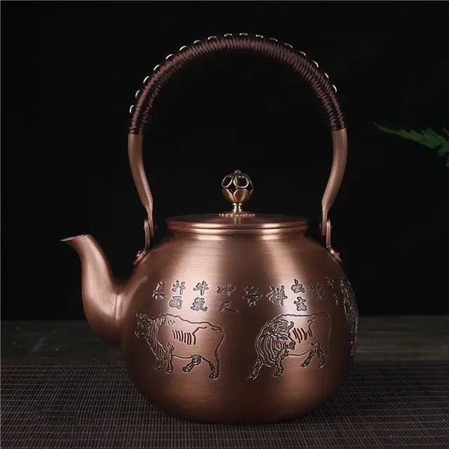 Chinese copper teapot 1.5 L - hand-carved bull motif detail in warm copper finish