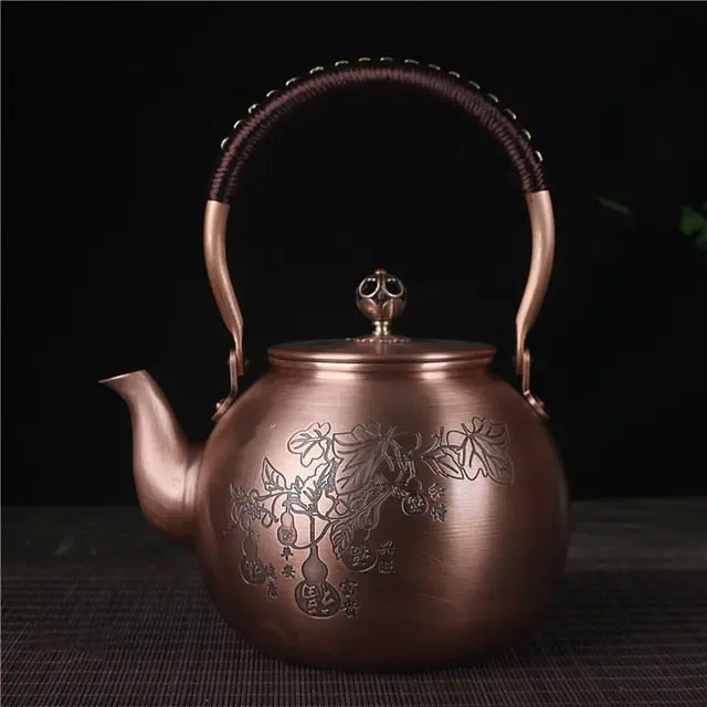 Copper tea kettle with leaf design, 1.5L, traditional Chinese style, side angle