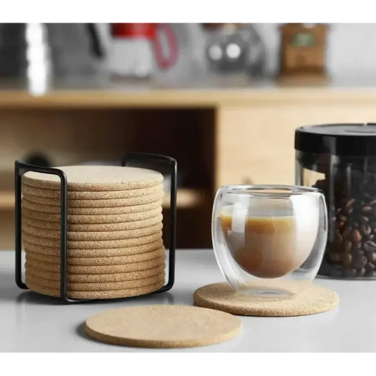 Round cork coasters for tea cups on a wooden table