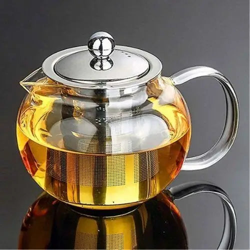 Glass teapot with removable stainless steel infuser basket shown open