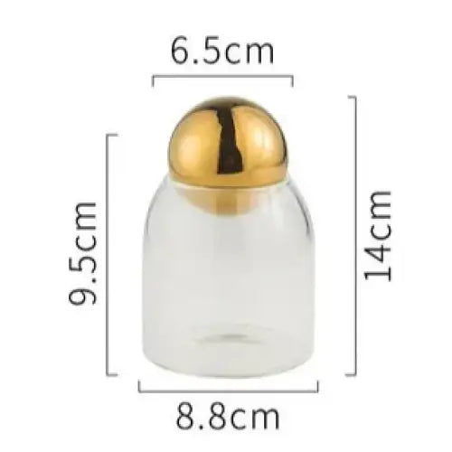 Small golden glass tea canister with lid, compact size for specialty teas