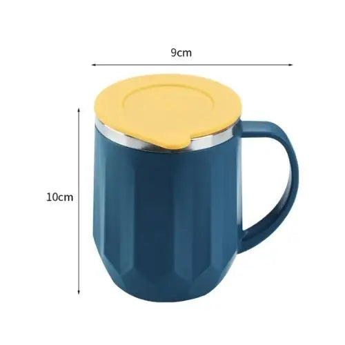 Insulated tea mug next to teapot