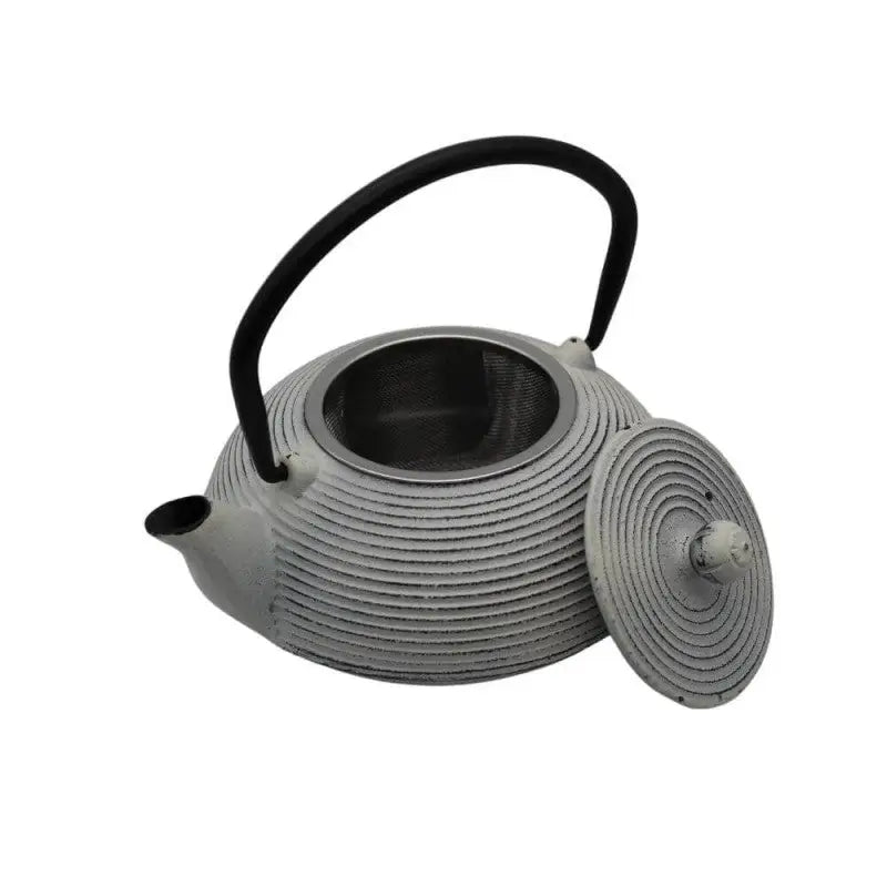 Close up of white enamel interior of cast iron teapot