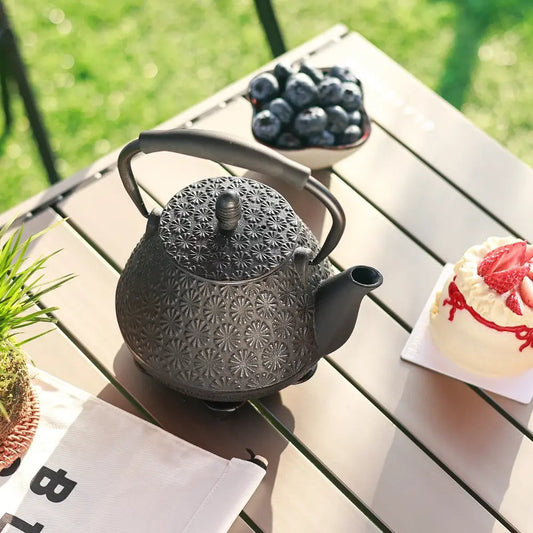 Japanese cast iron teapot pouring tea into cup