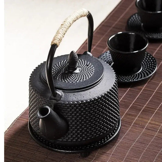 Cast iron teapot 800ml open lid showing removable stainless steel loose-leaf infuser