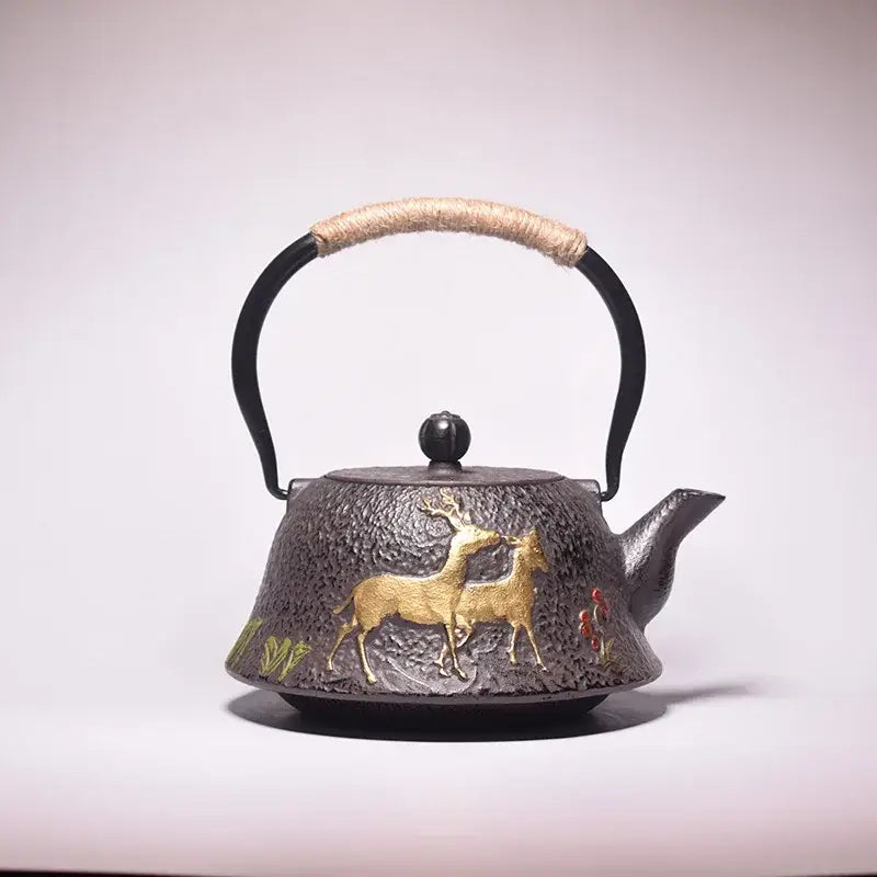 Cast iron teapot with deer motif, traditional design