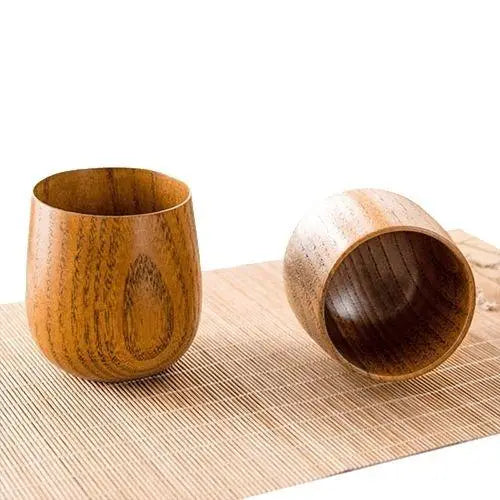 Two Japanese wooden tea cups side by side