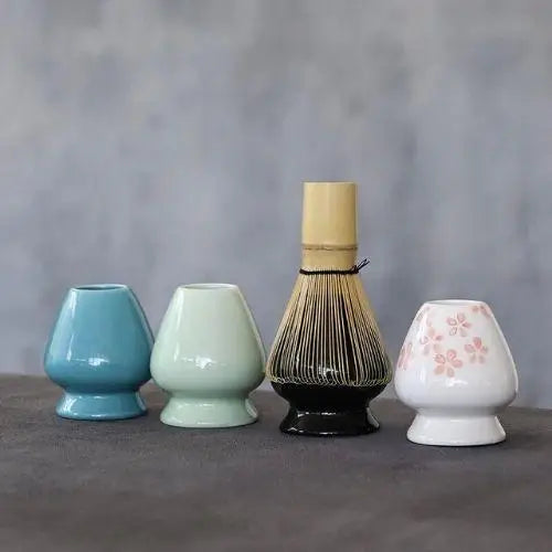 Matcha whisk holders in four colors: black, blue, sakura white and green