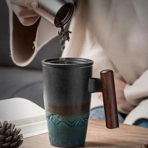 Teapot with infuser filled with brewed tea