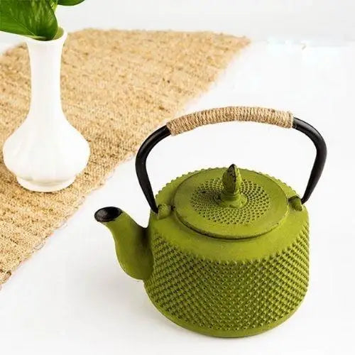 Green cast iron teapot lid detail showing enamel interior finish