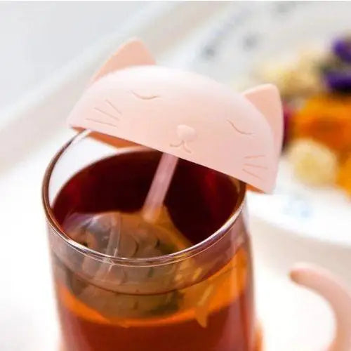 Pink cat glass tea cup with infuser in use, loose-leaf tea steeping