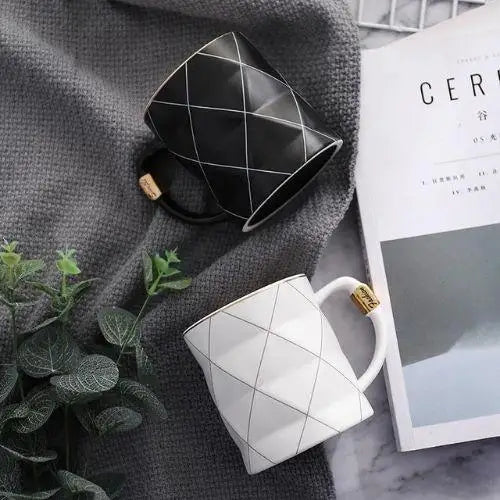 Polygon tea cup in white ceramic on a table