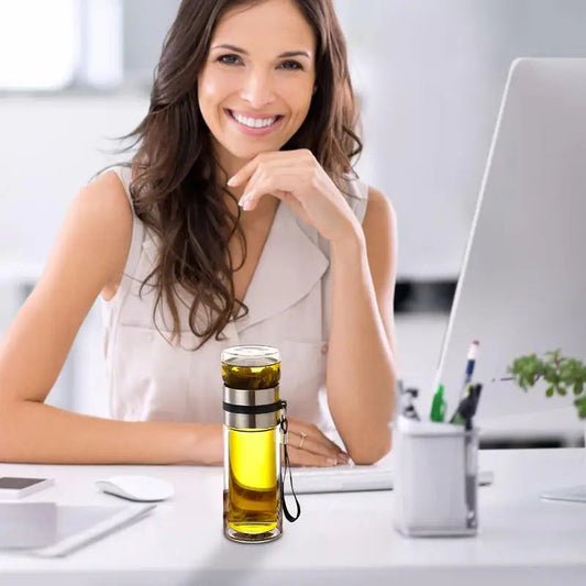 Borosilicate glass tea infuser bottle with built-in stainless steel strainer, side view