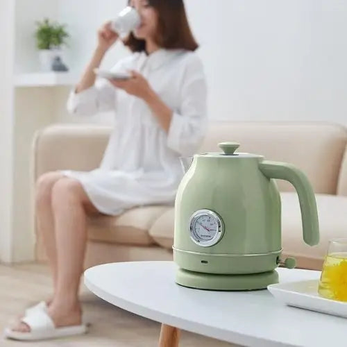 Retro green electric kettle on kitchen counter