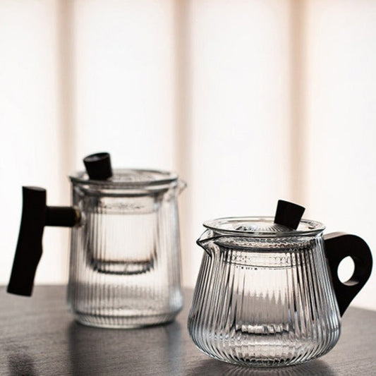 Loose leaf tea brewing inside Scandinavian borosilicate glass teapot