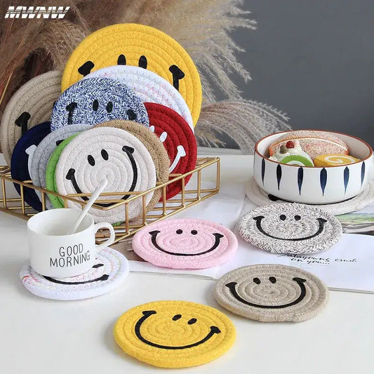 Handwoven cotton smiley coasters stacked together