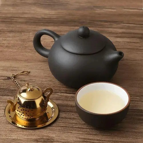 Stainless steel teapot infuser with tea leaves