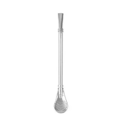 Silver stainless steel tea infuser spoon resting on mug rim