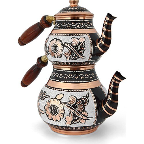 Close-up of copper caydanlik upper brewing pot showing brass handle and tin-lined interior
