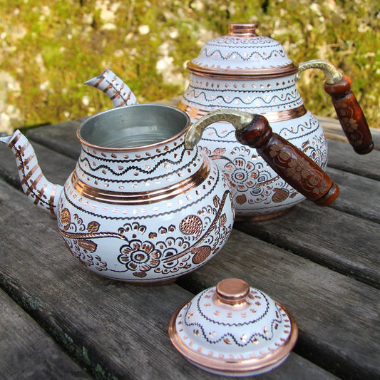 Turkish teapot pouring tea into tulip glass