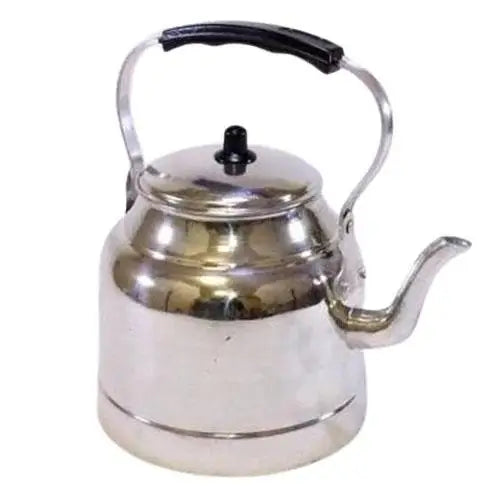 Vintage aluminum teapot with whistle on gas stove