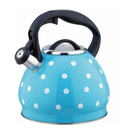 Vintage blue whistling teapot with polka dots on stove