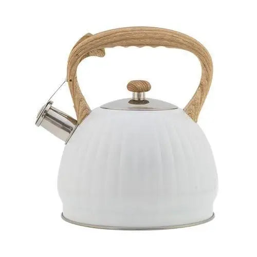 White shell whistling teapot on stovetop