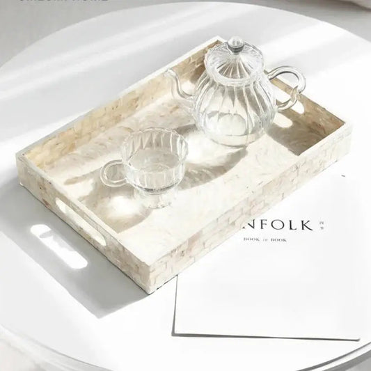 White tea tray with shell inlay on wooden table