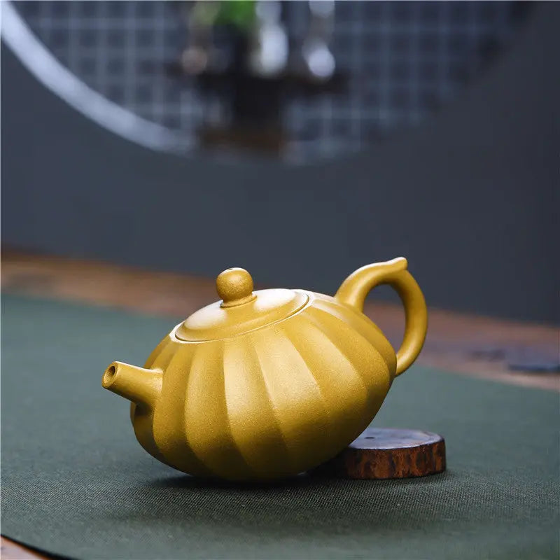 Handmade Yixing purple clay teapot showing raw unglazed Zisha clay texture and lid fit