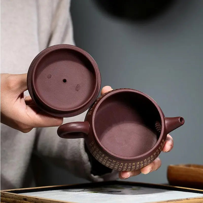 Yixing teapot with Chinese calligraphy side view, unglazed brown clay, 260 ml