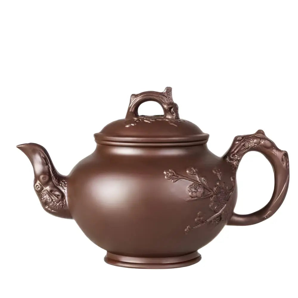 Brown Yixing clay teapot with carved flower detail, traditional Chinese design