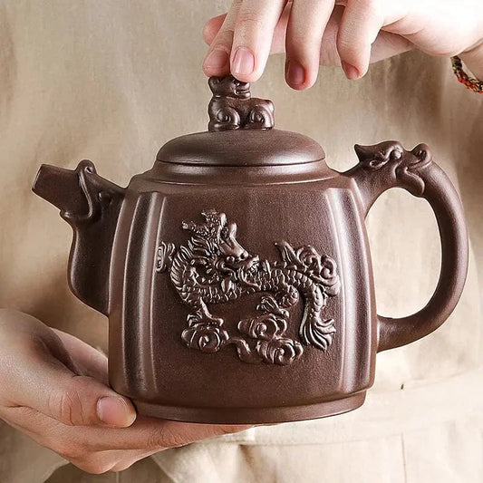 Handcrafted Yixing purple clay teapot with carved dragon design, 500ml