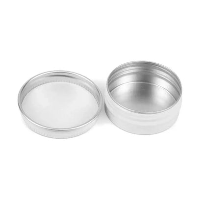 Full 50-piece loose leaf tea tin set laid out showing size variation