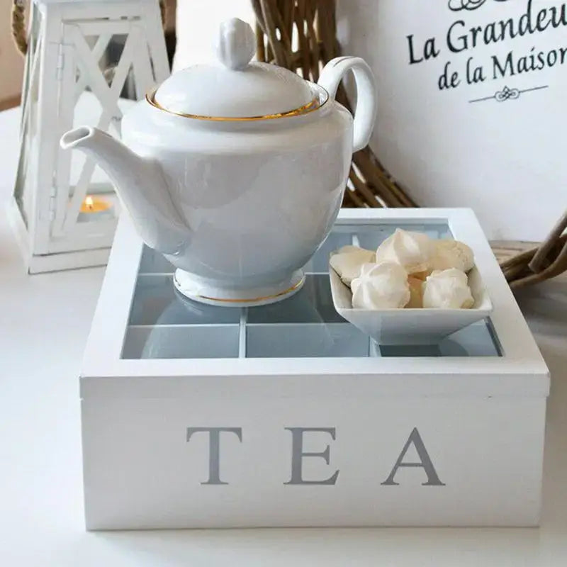 Wooden tea bag organizer box with clear lid filled with assorted tea bags