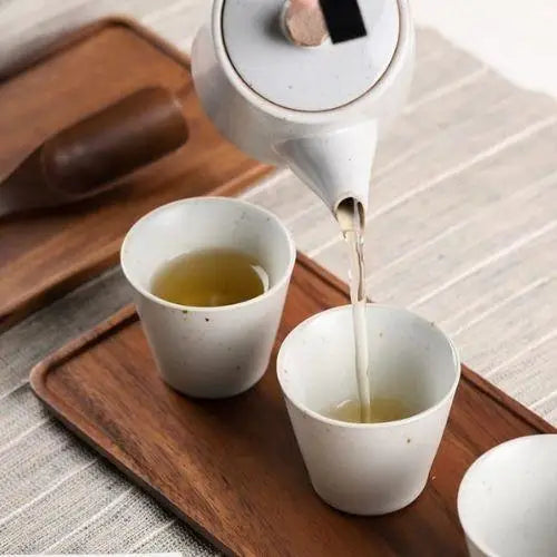Using acacia wood tea tray for tea service