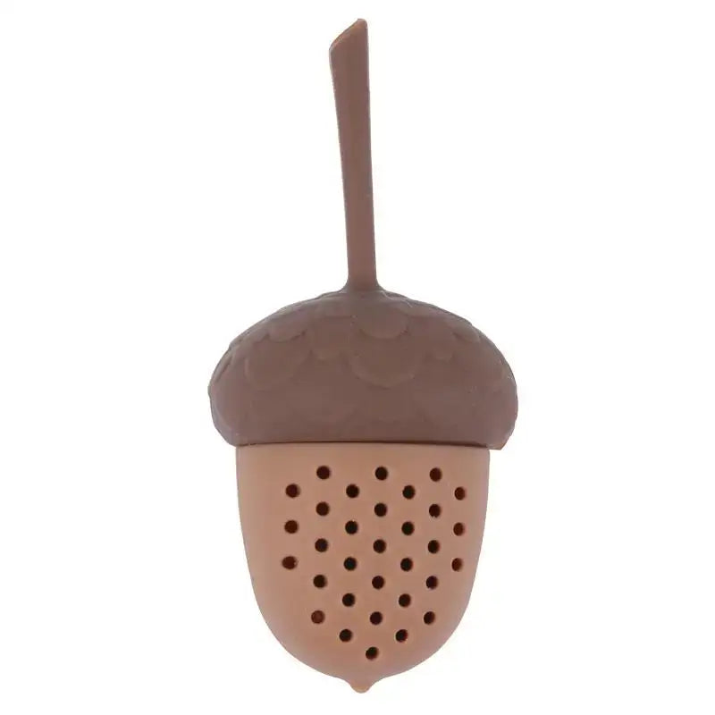 Cute acorn tea infuser with green tea leaves