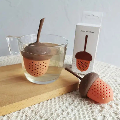 Acorn silicone tea infuser on a saucer