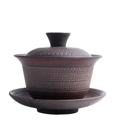 Ancient gaiwan tea bowl in natural earthy brown stoneware