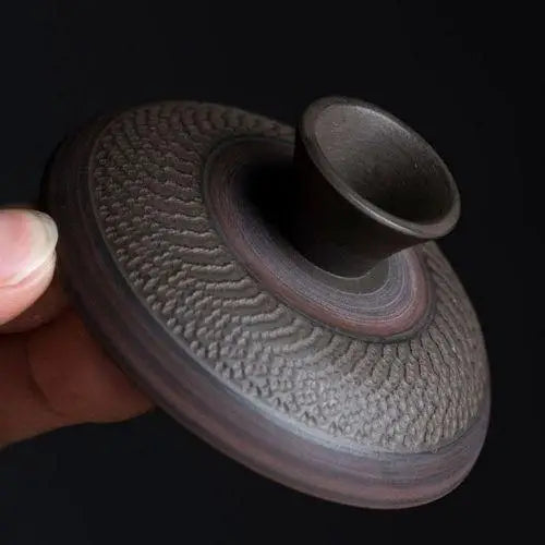 Close-up of gaiwan tea bowl lid handcrafted stoneware detail