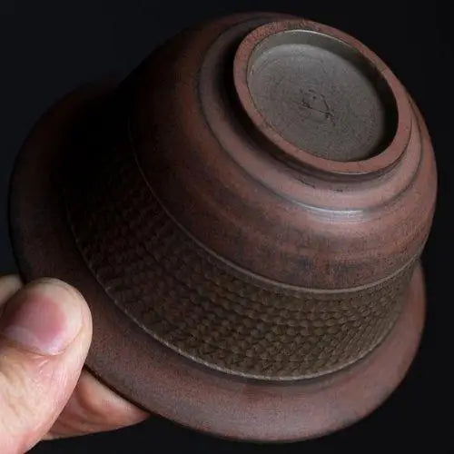 Bottom view of handcrafted gaiwan tea bowl showing clay base