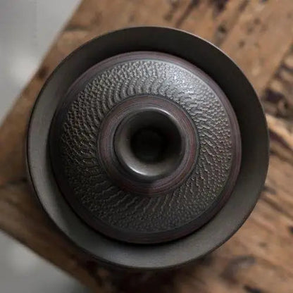 Top-down view of open gaiwan tea bowl stoneware interior