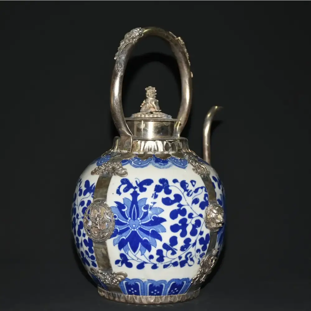 Close up of antique blue teapot spout and handle